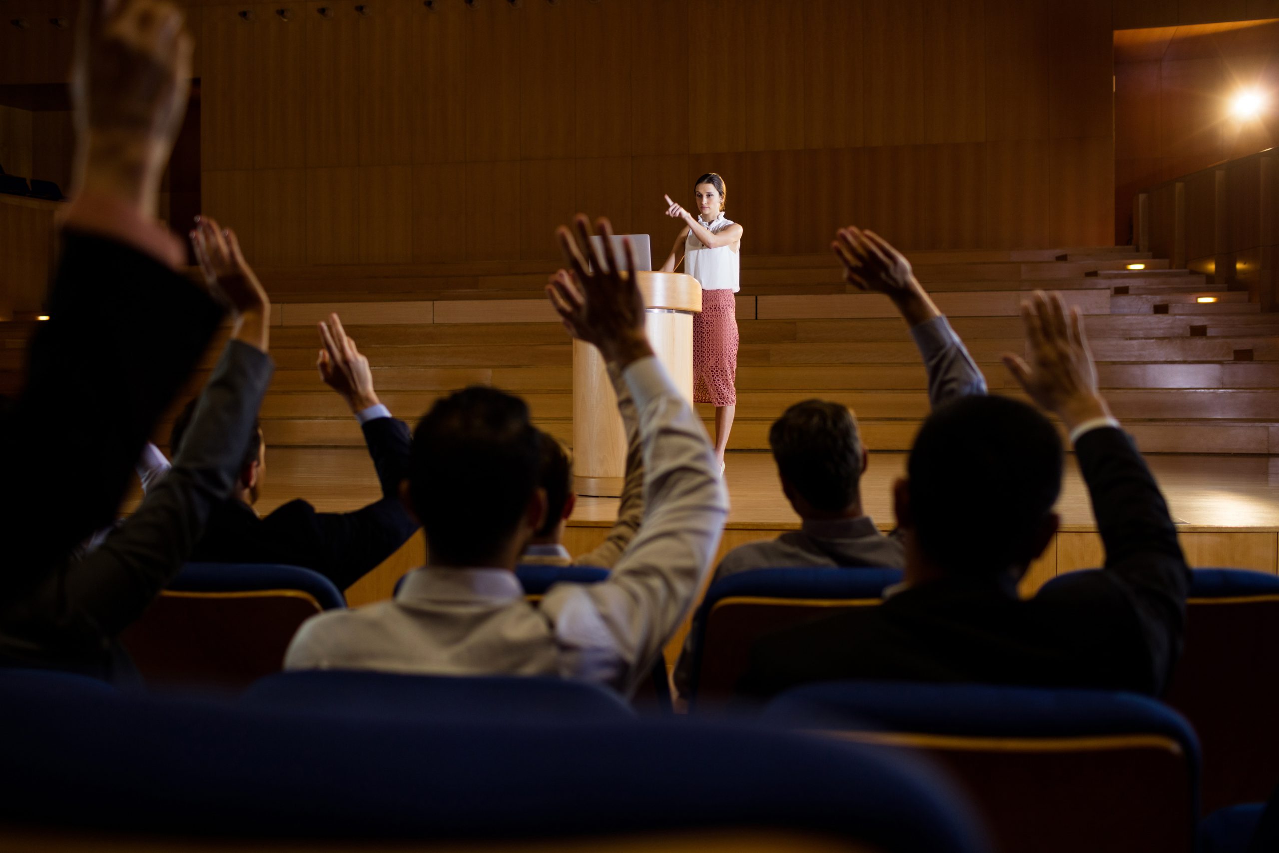 female-business-executive-giving-speech (1)-min